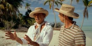 Billy Zane as Marlon Brando and Jon Heder as Bernard Judge at the beach in 'Waltzing with Brando' premiering at the 2025 Palm Springs International Film Festival