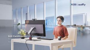 A woman using the ThinkCentre M90a Pro Gen 6 all-in-one for a video conference, with Focusound Screen® directional sound technology ensuring sound privacy, delivering clear audio only for her while the surrounding area remains undisturbed.