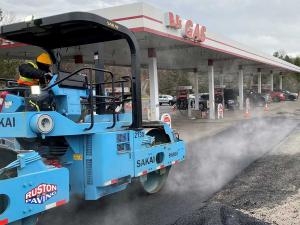 Paving company crews from Ruston Paving rolling new parking lot asphalt