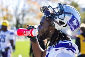 Western Football Player Drinking from Biosteel Bottle