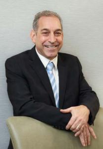 Gary A. Pagliarello, a personal injury attorney at Rosenberg & Gluck LLP posing for a photo, smiling.