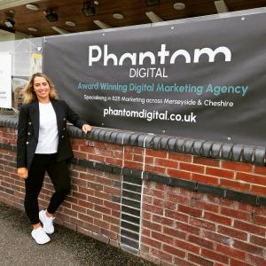 Female founder of Phantom Digital Justine Mclaughlin standing proud of her achievements in business this year