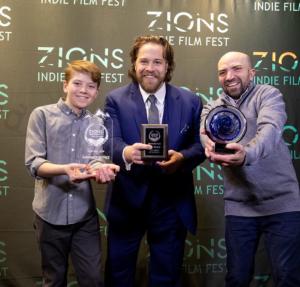 "The Faith of Angels" director and actors posing with their 2024 jury awards, including 3rd place Feature Film category, Feature Film Audience Choice Award, and the Zions Indie Spirit Award, Grand Prize award of the festival