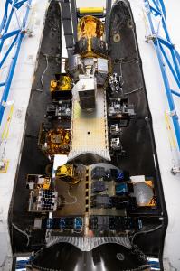 The payload section of the SpaceX Falcon 9 rocket with the Naval Postgraduate School CubeSat, and more 100 other small satellites.