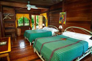 Itza Resort Family Room on Longe Caye, Lighthouse Reef Atoll