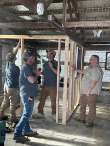 MRC Restoration crew actively working on the construction of a new room at the Desloge City Pound to enhance animal safety and comfort.