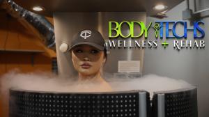 A woman in a cryotherapy chamber at Body Techs Wellness + Rehab, surrounded by a cloud of cooling mist, experiencing deep muscle recovery, reduced inflammation, and enhanced circulation for overall wellness.