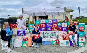 Richard Zenker, Christina Irving and BWCF volunteers collect donated diapers