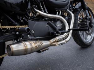 A Harley-Davidson Sportster motorcycle equipped with a Sawicki Speed exhaust system.