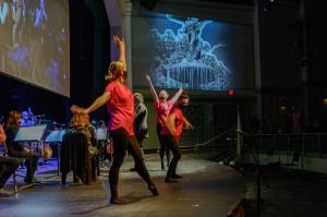 Orchestra performing with dancers from Annalisa Ledson dance company.