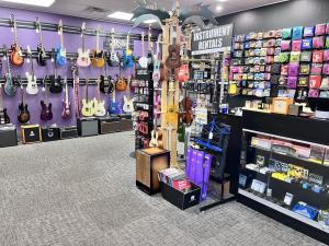 Inside RiverCity Rock Star Academy’s music store in Salem, Oregon, showcasing a wide range of instruments, lesson rooms, and performance areas for students and musicians.