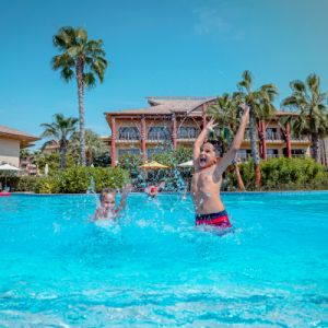 Children playing in he pool at Lapita Hotel