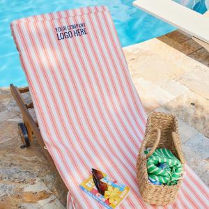 Personalized towel on top of a poolside lounge chair.