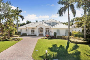 A modern estate at 650 Bow Line Drive in The Moorings, one of Naples’ first communities dating back to the 1950s, featuring a mix of Art Deco, Spanish Revival, and contemporary homes alongside an 18-hole, par-63 golf course.