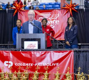 John Kooyman, President of Colgate-Palmolive North America, speaks during the opening ceremony of the Colgate Women’s Games finals on February 1, 2025 at the Nike Track and Field Center at the Armory in Manhattan. Behind Kooyman stood (l.to r.) New York C