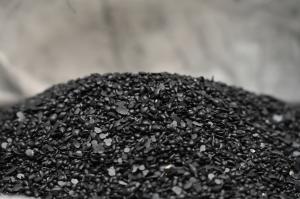 Image of black specialty wax pellets made by GreenMantra Technologies