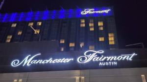 Illuminated high-rise sign for Fairmont Austin, featuring the rebranding to Fairmont Manchester, expertly fabricated and installed by Royal Signs & Awnings.