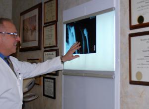 Dr Leonard Marchinski, Orthopaedic Doctor, reviewing x-ray