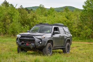 A Toyota 4Runner with a winch lead extended.