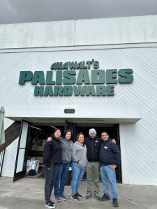 Anawalt team member pose in front of the reopened Palisades store