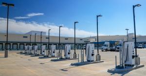 Image showing multiple electric fleet charging stations in front of a building, promoting clean, sustainable transportation - the type of solution more easily available to businesses and organizations taking advantage of InCharge Energy's newly announced 