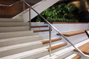 Terrazzo design: steps with integrated wooded benches 