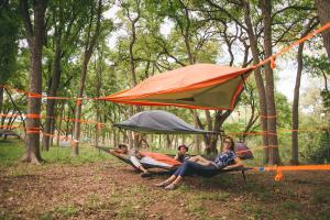 The tree tents are well equipped with blankets, towels, and sleeping bags included to comfortably fit two.