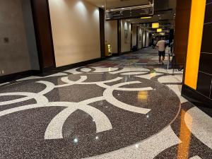 Epoxy terrazzo design: medallion in an intersection of the CityCenter Las Vegas casino walkway.  
