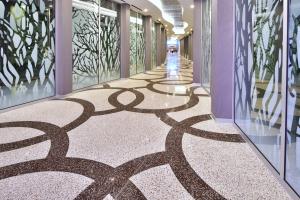 CIrcular loop patterns in epoxy terrazzo design in the CityCenter Las Vegas casino walk way. 