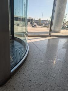 Epoxy terrazzo design: terrazzo floor in natural light against a glass wall in Detroit's WAyne County criminal justice center. 