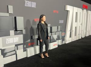 Photo of actress Eden Lee standing on the black carpet at the premiere of new Netflix series ZERO DAY