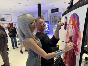 Photo of Aliia Roza painting with Rob Prior in Miami