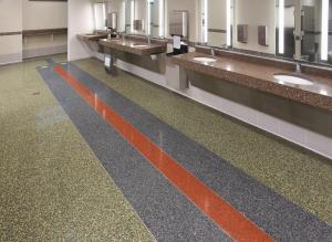 terrazzo design in green, gray, and red in the airport. 
