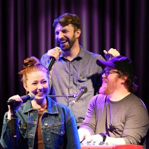 3 members of Musical Monday around microphones.