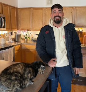 J. Blanton Plumbing technician assisting a client with plumbing services, highlighting expertise in bathroom plumbing and plumbing fixture installations in support of the Northwestern Settlement Speaker Series