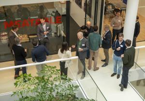 A shot from above of people gathering outside the meatable offices