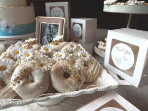 Brandon's Donuts custom bridal shower donuts, beautifully decorated with white icing, gold accents, and edible flowers—perfect for weddings, parties, and special occasions catering.