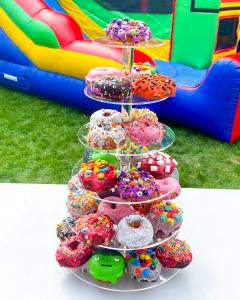 Brandon's Donuts tiered donut tower with colorful, custom-decorated donuts, perfect for catering at birthdays, corporate gatherings, and special events.