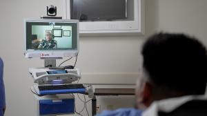 a psychiatrist treats a patient via telemedicine