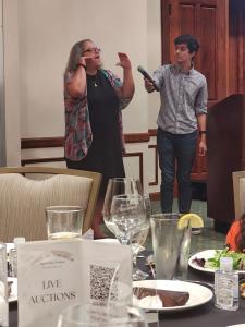 lady standing teaching sign language