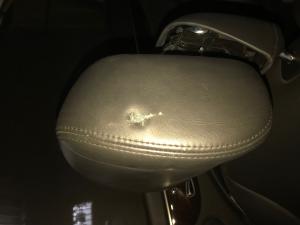 Bullet hole in One Hunnet’s head rest