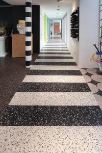 Terrazzo design: stripes in terrazzo run down the hallway.