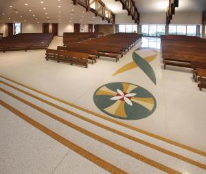 Terrazzo Design: Gold steps lead to the sanctuary and a benedictine cross. 