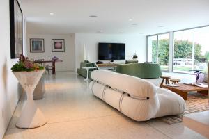 Terrazzo design: contemporary living room with neutral terrazo floor in Hollywood Hills remodel.