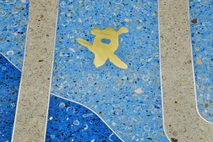 Terrazzo design: public art brass turtle embedded in terrazzo