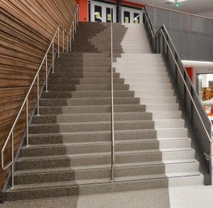 Terrazzo desig: Geometric pattern in three colors flow down the precast terrazzo staircase.