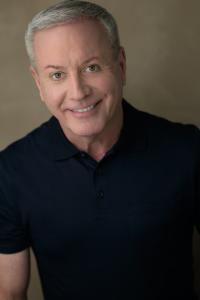 Mark Pettit headshot wearing a dark navy polo shirt.