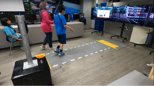 Teachers from Rainbow Centre Guiding Students to learn Road Safety with the AR modules Road Safety Training Simulator designed by FXMedia