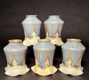 Set of five Quezal blue double-hooked pulled-feather shades with gold aurene interior. Estimate: $500-$700