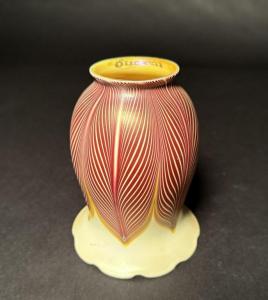 Quezal lampshades include lot #160, a pulled-feather selenium red tulip shade with crimped bottom and gold aurene interior. Estimate: $600-$800